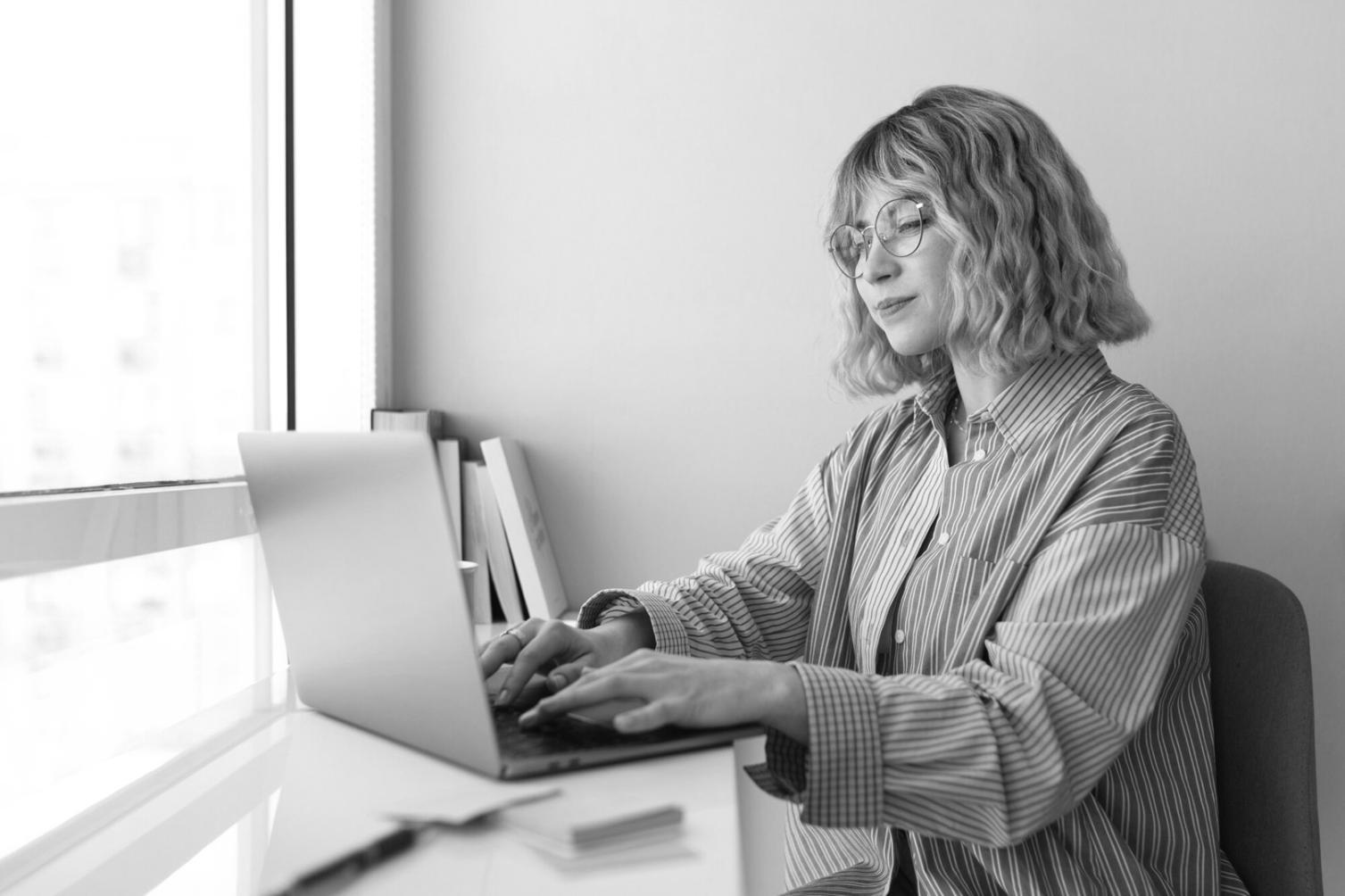 Professional workspace showing financial analysis and budget management tools in use
